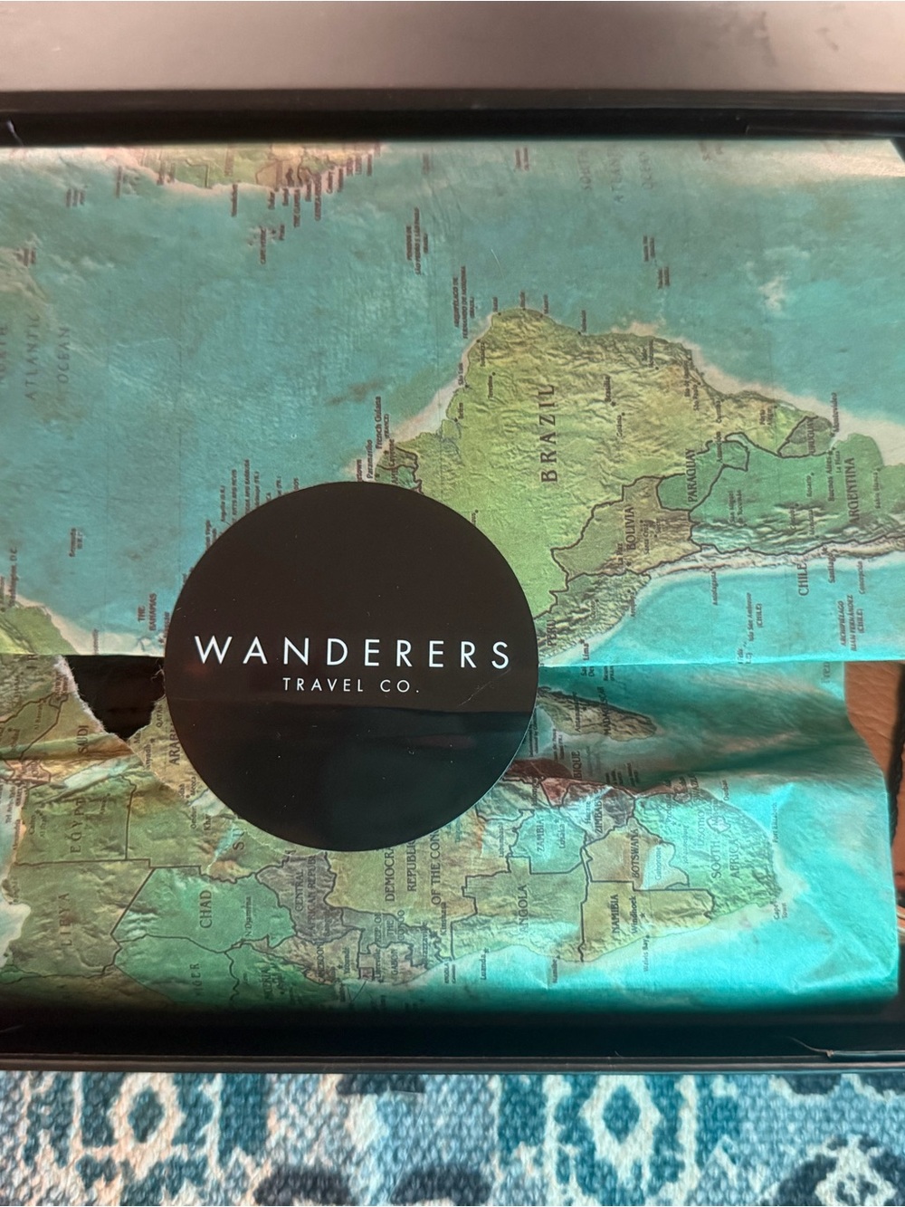 Wanderers Travel Co. Map Print with Black Logo Sticker